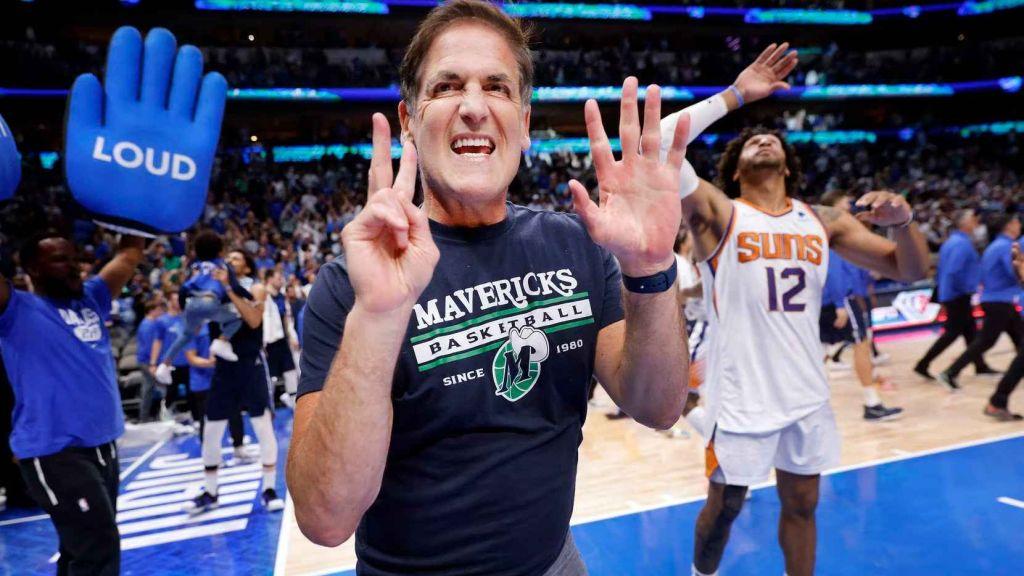 Mark Cuban in the NBA court supporting his Mavericks team. 